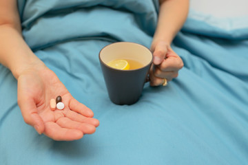 Woman hands taking medicines