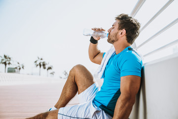 Beautiful man doing work out and different exercises outdoor