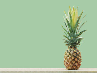 pineapple on green background.