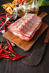 Raw fresh meat Veal rib Steak on bone and seasonings on dark background