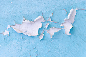 Peeling paint and wall cracks texture background.