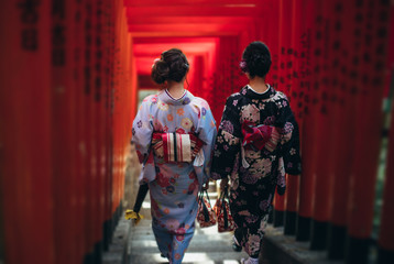 Two japanese girls wearing kimonos traditional clothes, lifestyle moments