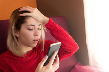 Woman talking on the phone at home in winter