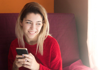 Woman talking on the phone at home in winter