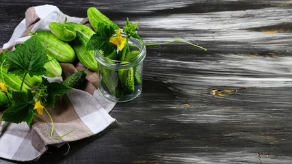 The concept of healthy food. Fresh vegetables, cucumbers. On a wooden background. Top view. Copy space