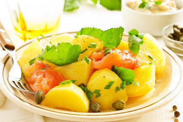 Boiled potatoes with green onions and salt salmon.