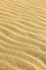 Fototapeta na wymiar Natural pattern of sand. Close up 
