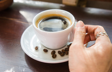 Black coffee on a wooden table in a coffee shop