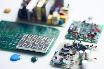 Microprocessor concept. Set of drivers, diodes, capacitors, inductance and other micro electronics on the white background. Top view. Space for a text. Close up.