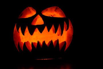 Spooky halloween pumpkin on a black background