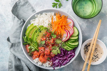  salmon poke bowl (avocado, salmon, carrot, cucumber, red cabbage, radish and rice) - obrazy, fototapety, plakaty
