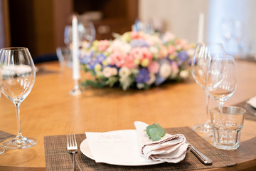 focus on the dining napkin with eucalyptus. beautiful flower arrangement. Wedding Banquet or gala...