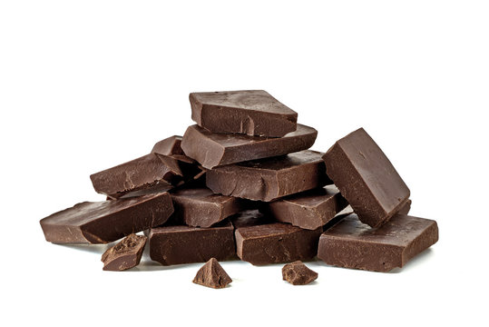 Broken chocolate blocks or pieces stack pile isolated on white background