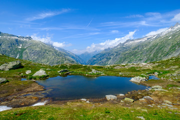 Fototapeta na wymiar Lake in Switzerland mountains, near Grimsel pass