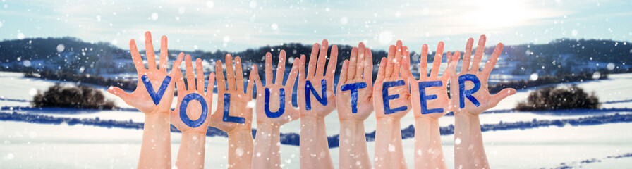 Many Hands Building Word Volunteer, Winter Scenery As Background