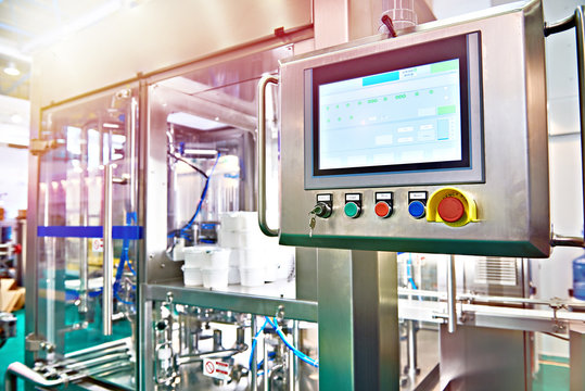 Control panel monitor on conveyor at food factory for packing