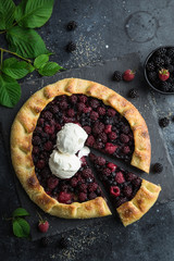 blueberry, blackberry and raspberry galette with vanilla ice cream