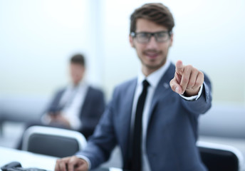 Successful adult man is looking at screen of modern gadget