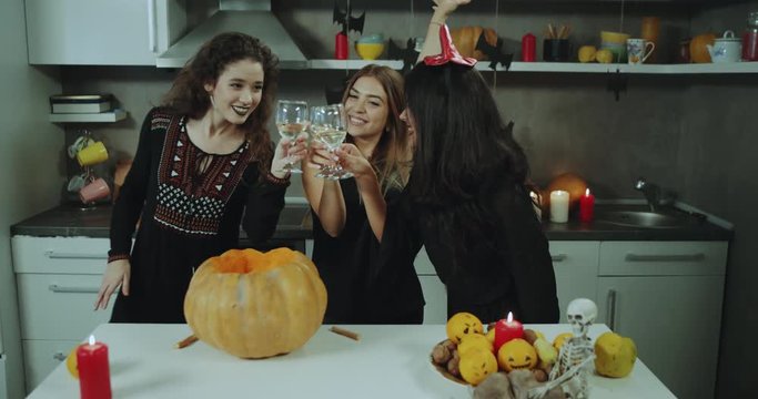 Perfect Halloween party for young ladies seeping a great time , dancing and drinking wine on Halloween night.