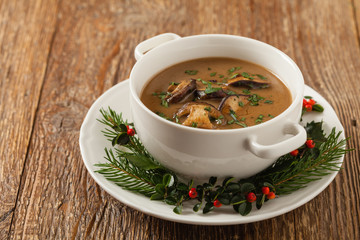 Traditional mushroom soup, made from porcini mushrooms. Christmas decoration.