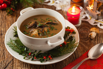 Traditional mushroom soup, made from porcini mushrooms. Christmas decoration.