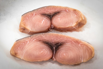 Fresh fish steak in ice on the market
