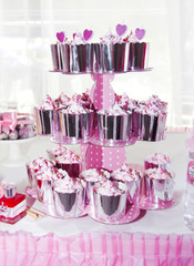 sweet cupcakes white cream and decoration in a shiny package for the holiday