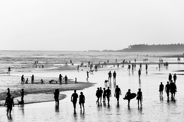 Fototapeta na wymiar People walking on beach. Bali