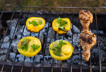 Eggs in bolgarian pepper with toast and chicken grilled on coals in the grill