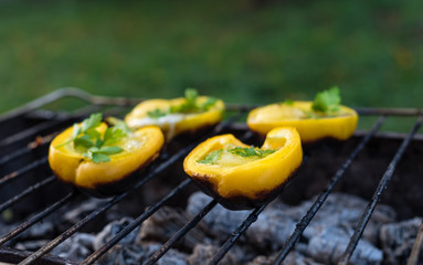 Eggs in Bolgarian pepper grilled on coals in the grill