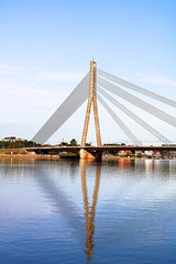 Fototapeta na wymiar The Vansu Bridge in Riga is a cable-stayed bridge that crosses the Daugava river in Riga, Latvia