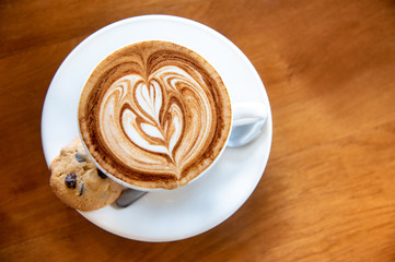 Nice coffee latte with cookie