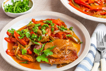 Italian food - pork chop with apples and peperonata