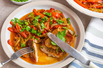 Italian food - pork chop with apples and peperonata