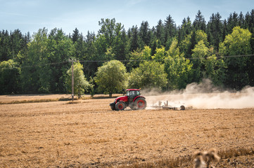 Tractor plows a field - agriculture and agronomy concept