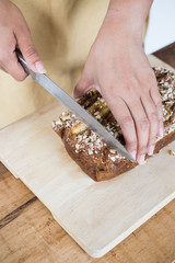 Women Cutting Freshly Baked Banana Bread