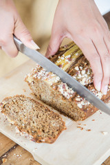 Women Cutting Freshly Baked Banana Bread