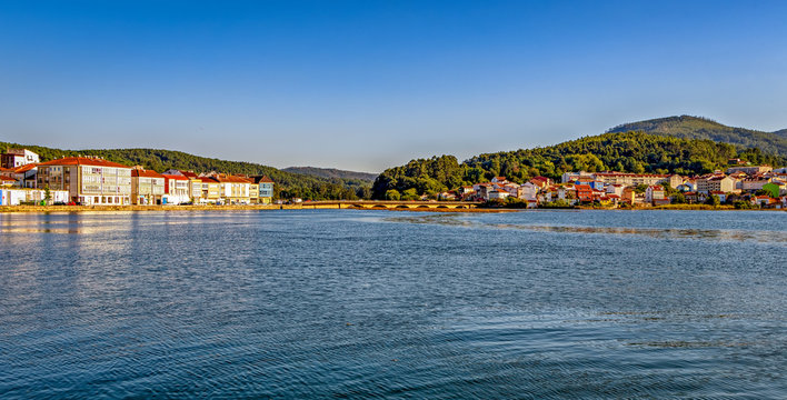 Panoramic view of the colorful town of Noia by the water in Galicia, Spain.