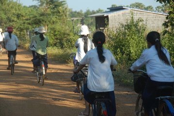 Students riding bicycles to school