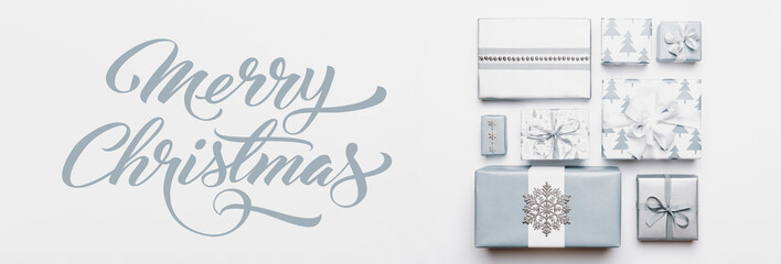 Christmas gifts banner. Beautiful nordic christmas presents isolated on white background. Pastel blue colored wrapped xmas boxes. Gift wrapping concept.