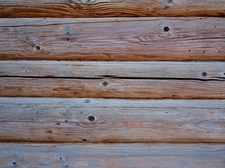 Obraz premium a fragment of the wall of the old house of logs