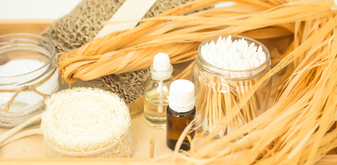 Eco accessories for body care and spa - bast, loofah, wooden cotton swabs in a glass jar, essential...