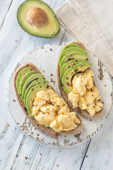 Sandwiches with avocado and scrambled eggs
