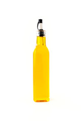 Rapeseed Oil in a Glass Bottle on White
