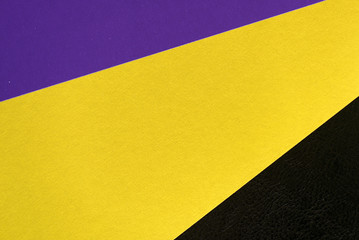 Background and texture of multicolored sheets of cardboard close up