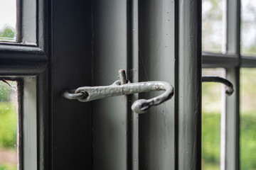 The window with latch of an old farmhouse, inside