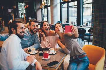 Group of Happy friends having making selfie in cafe - obrazy, fototapety, plakaty