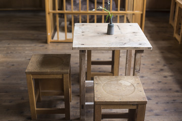 Interiors of a cafe. wood tables and chairs. Vintage classroom effect.