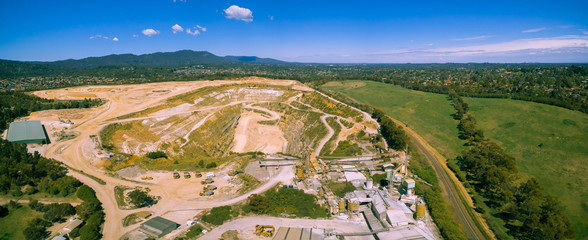 Limestone mine and heavy machinery in Melbourne, Australia - aerial panorama landscape
