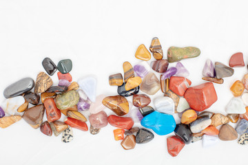 Colorful stones against white background